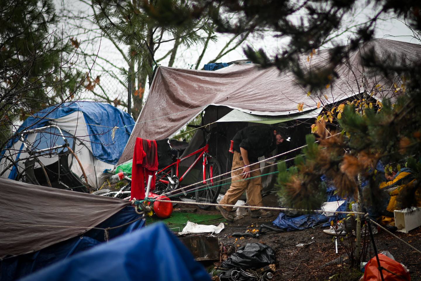 Homeless camps in rain